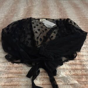 Black sheer blouse with plunge neckline and tie front